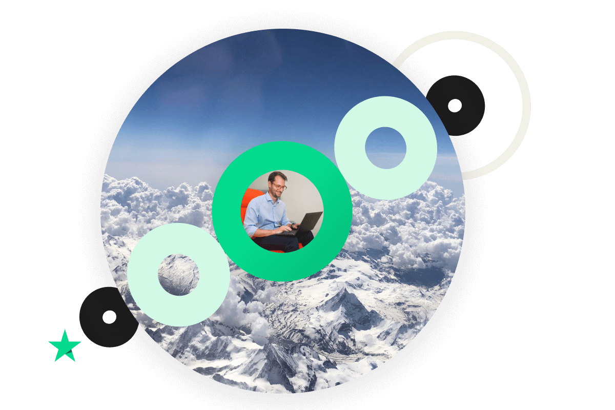 A photo of mountains and clouds contained in a Circle shape with smaller circles overlayed in a diagonal format