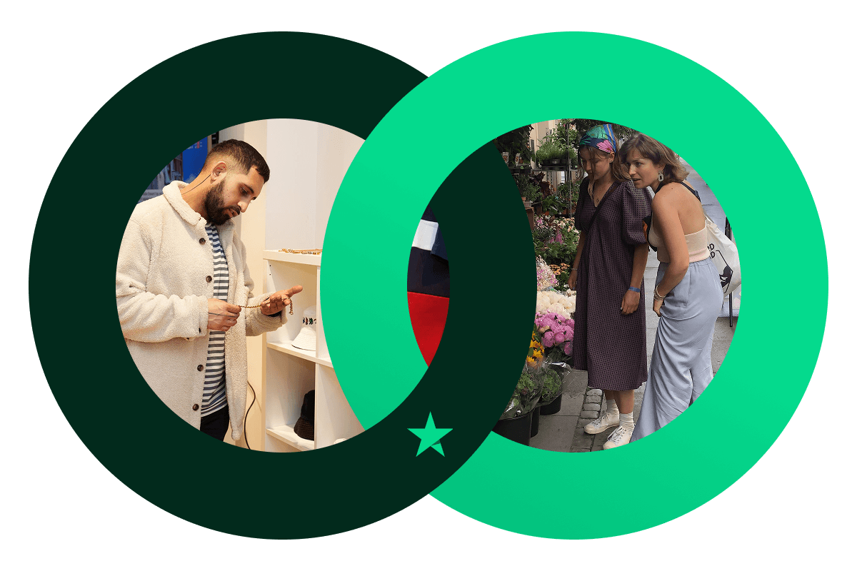 A graphic of a Dark Green and a bright Green circle interlocking, a symbol of trust. The Dark Green one features an image of a man looking at a piece of jewellery and the bright Green one features an image of two women looking at flowers at a flower stall