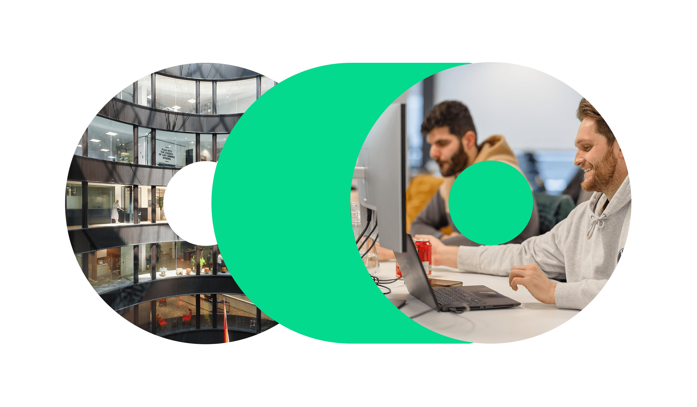 A photo of two men working at their desks