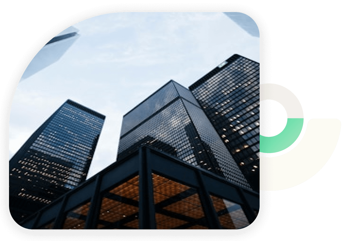 Upward view of modern glass skyscrapers against a cloudy sky, overlaid with abstract geometric design elements.