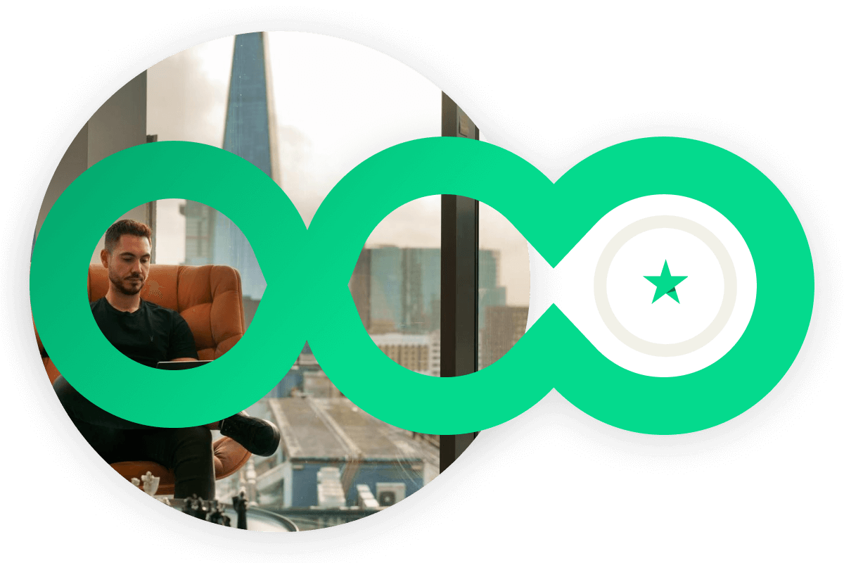 A photo of a man sat down using his Tablet with an overlay of 3 Green intertwining circles. The Trustpilot star is featured in the centre of the 3rd Circle
