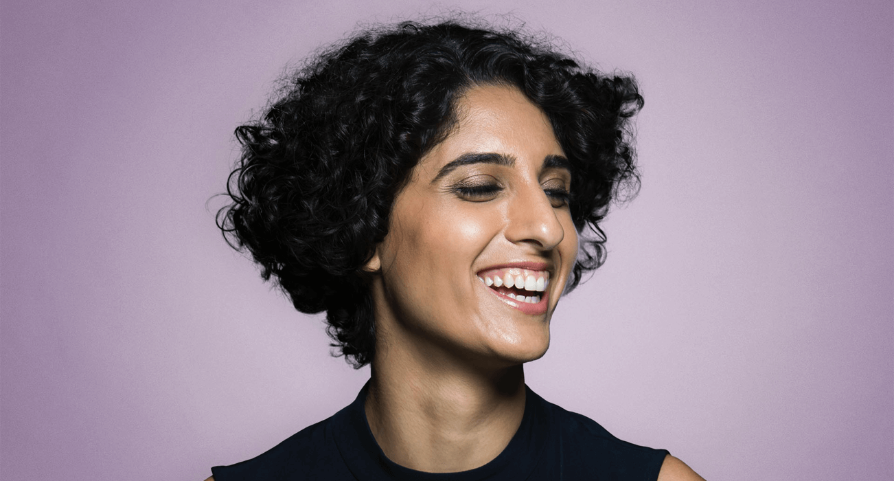 A headshot of a Woman with short hair smiling